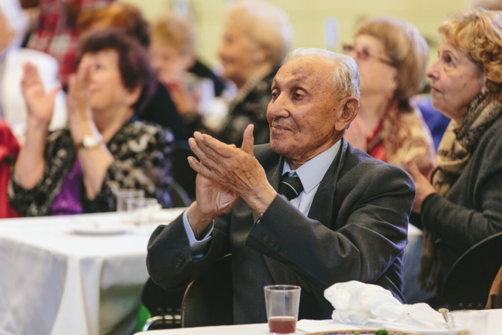 Man clapping at Victory Day celebration